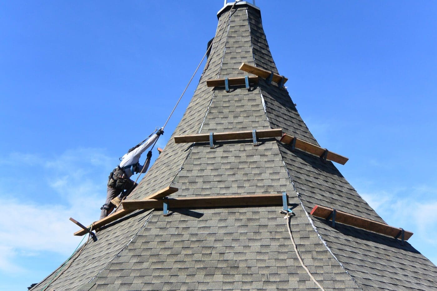 Shingle roofer working on steeple church Marin County, CA.